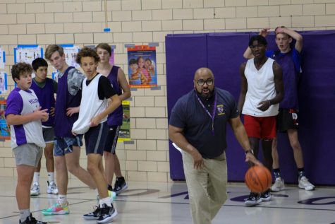 Coach Marcus Gill with his players during practice