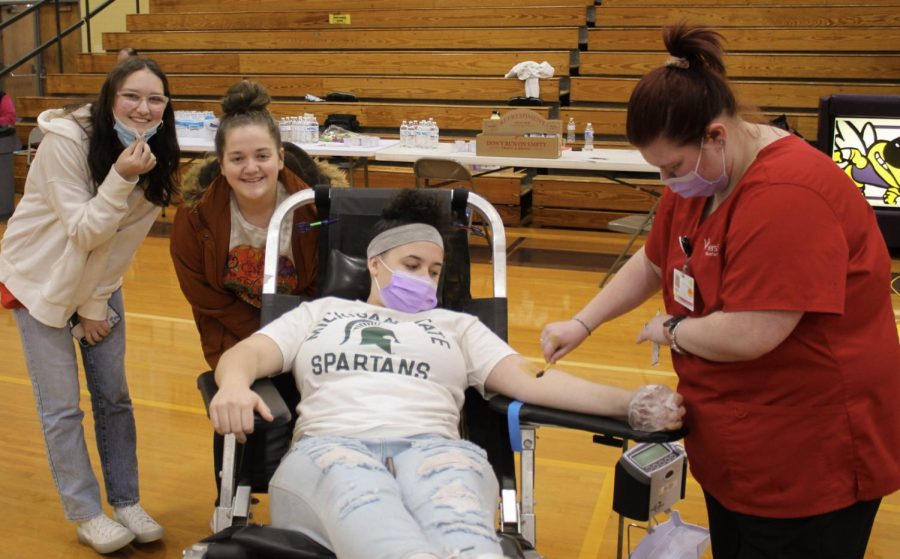 NHS members Paityn DeForest and Maddy Connelly giving support to one of our donors, Mariell Bommarito.