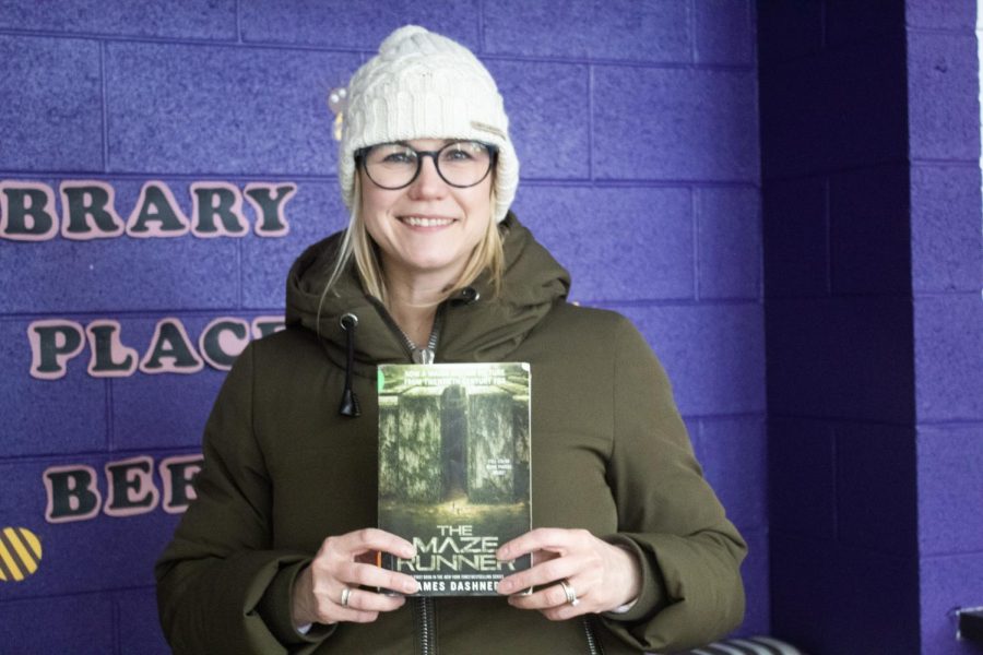 Mrs. Hutchinson poses with The Maze Runner