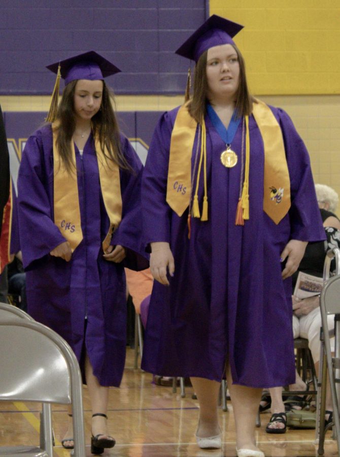 Luce Macchiavelli and Madison Coburn walking to their seats.