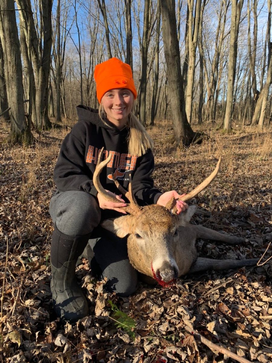 Zoe Schultz with her buck.

Courtesy of Zoe Schultz