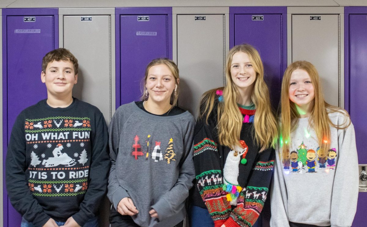 Easton Woolworth, Avery Arbuckle, Iyla Weeks, and Bradie Lehman show off their holiday attire.  