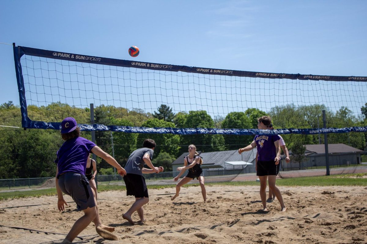A group of students playing volleyball