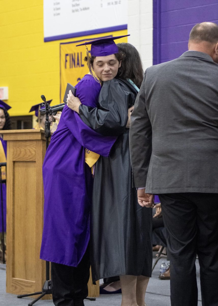 Nolan Mattson giving his mom a hug after receiving his diploma.