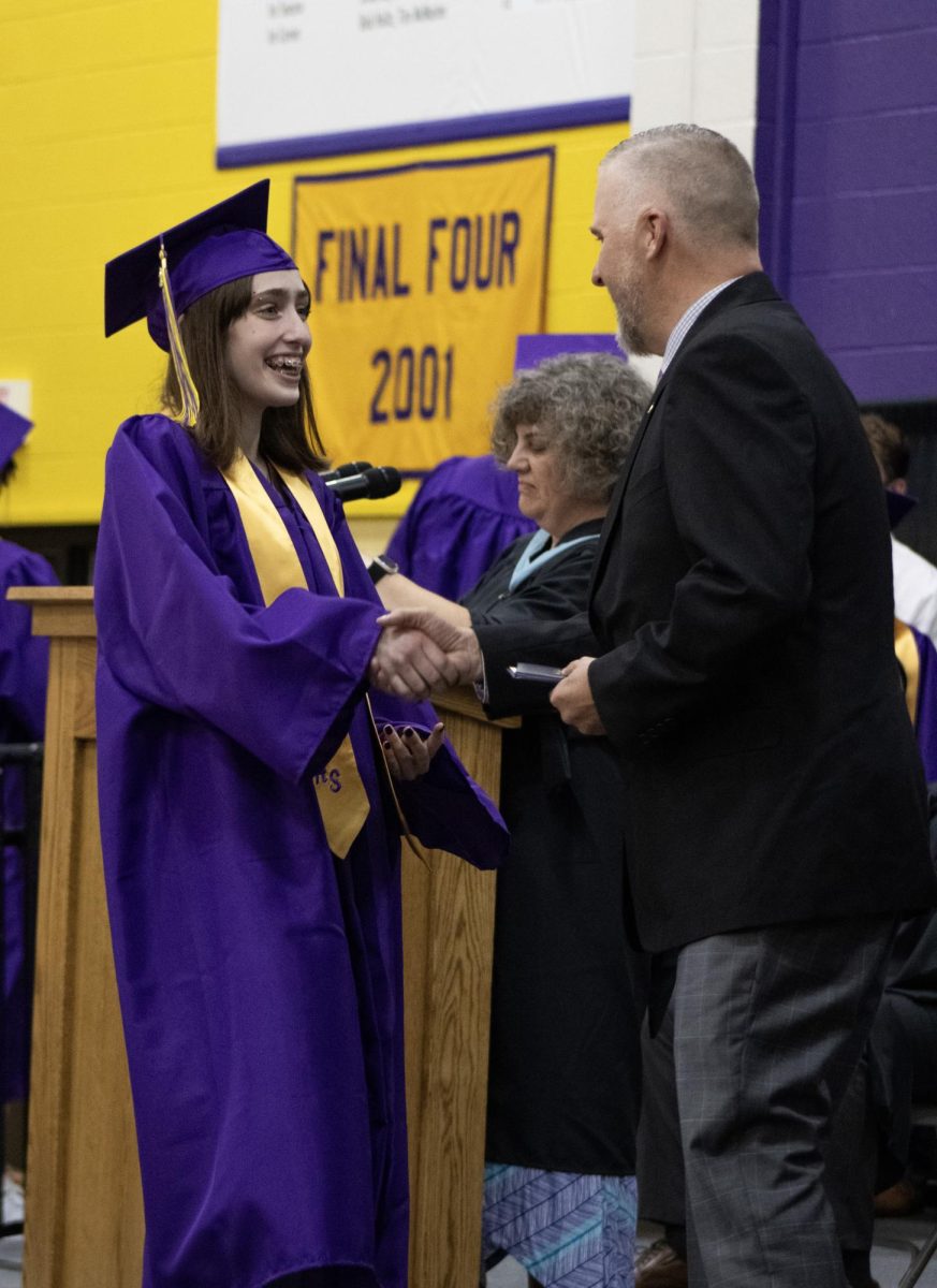 Kayla Holland receiving her diploma.