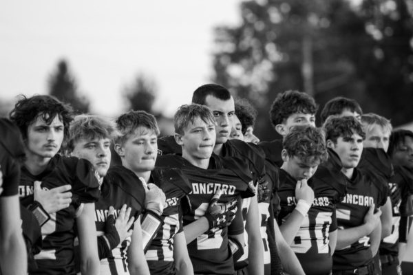 Varsity football respects the flag prior to their Homecoming game on October 4th. 