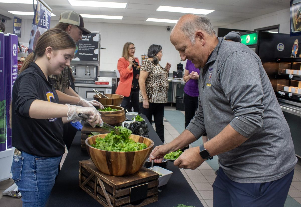 Jur trying some of the freshly grown lettuce for lunch.