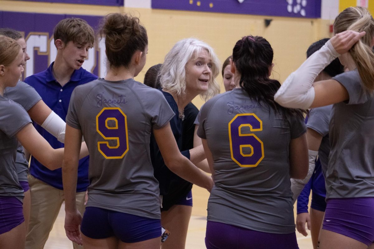 Varsity Head Coach Kathy Lehman keeps her team focused on each execution during their competition vs. Stockbridge. 