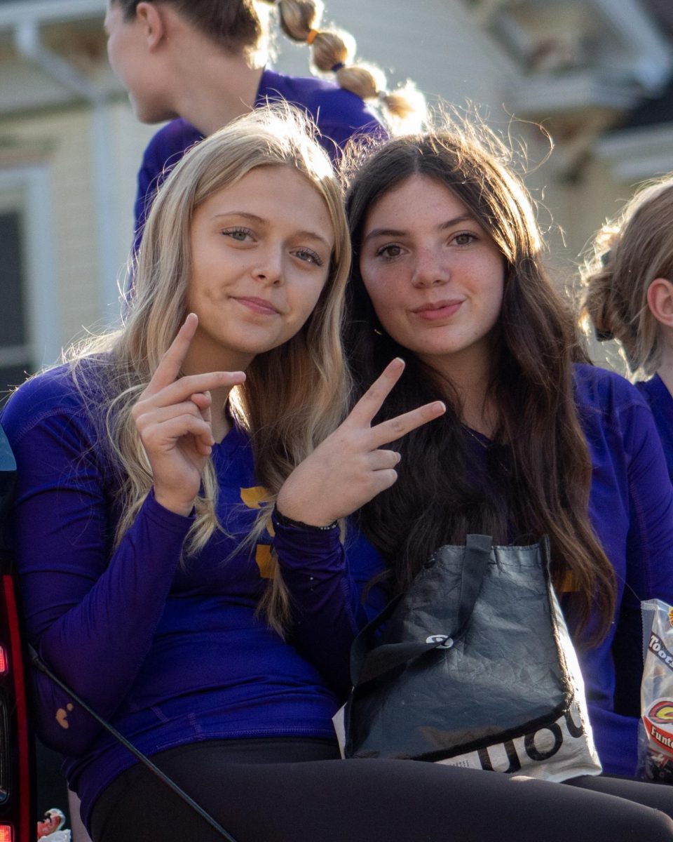 Reagan Mehl, and Evelyn Goldsmith riding on their volleyball parade