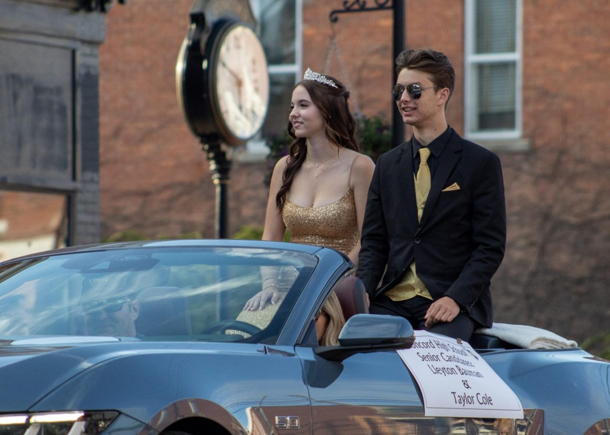 Senior candidates, Lleyton Bauman, and Taylor Cole, going through the parade.