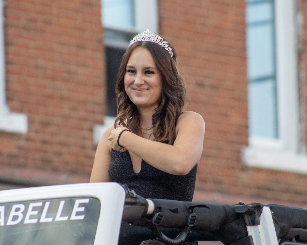 One of the homecoming queen candidates, Izzabelle Lagow proudly riding through the parade