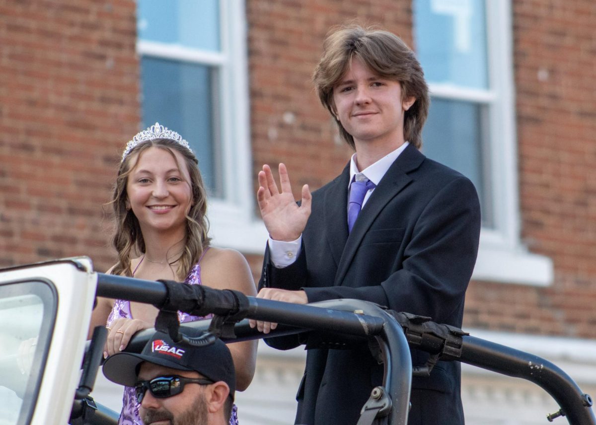 Senior homecoming candidates, Danni Fritz and Riley Aiken riding through the parade.