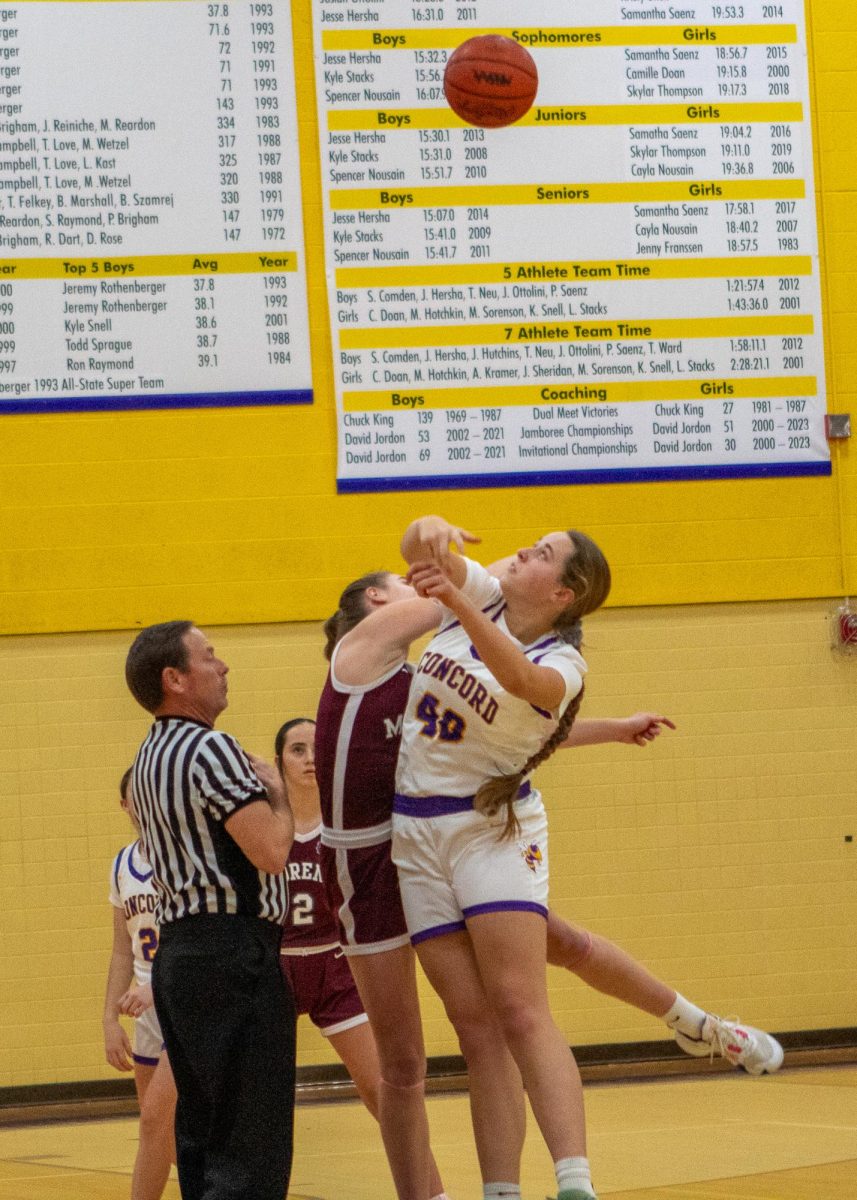 Grace Thorrez takes the game opening tip on Monday's game against Morenci. 