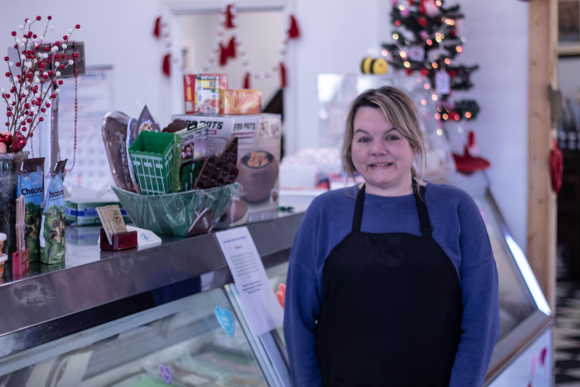 Laurie Sinden standing in the entrance of the shop