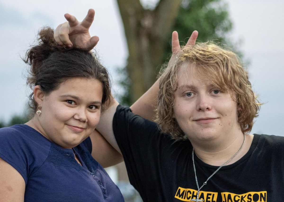 Jayden with Kristin Parker during a football game.