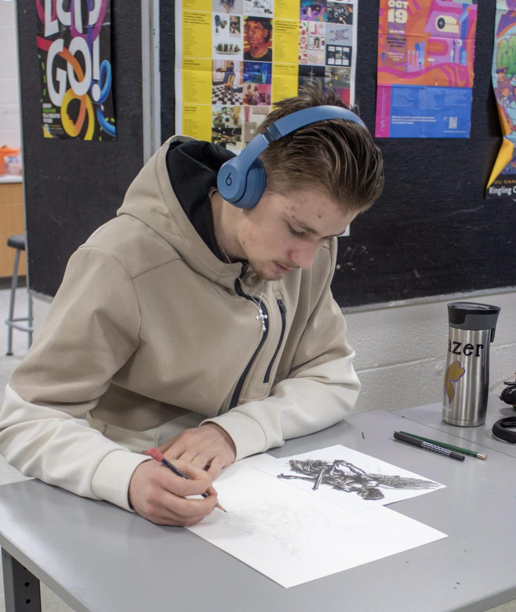 Trenton Frazer working on his new pen & ink piece. 