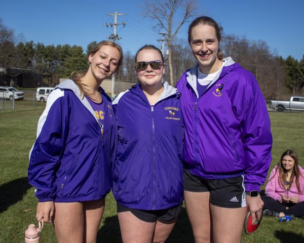 Shot putters Avery Arbuckle, Bella Coppernoll, and Grace Thorrez after their shot put attempts.