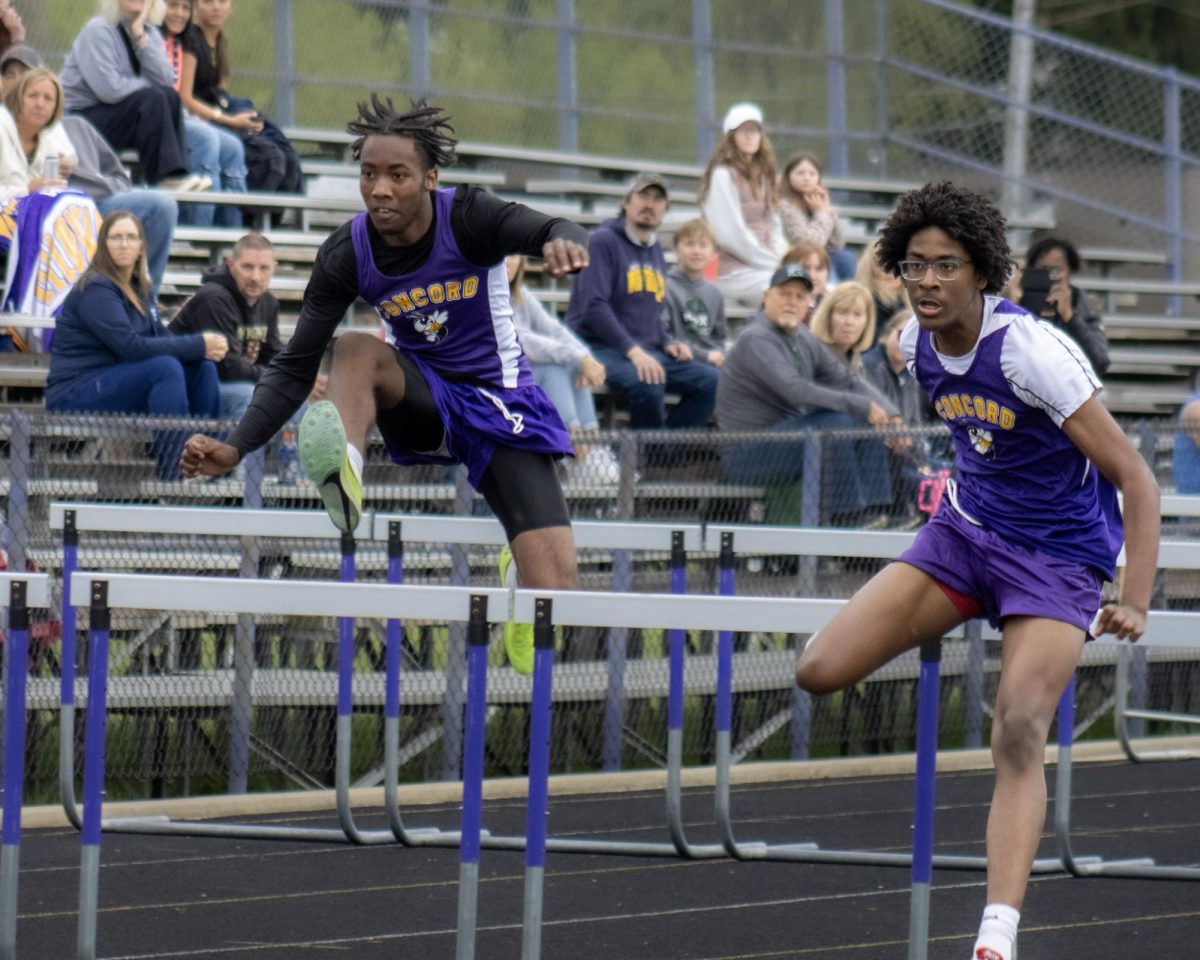 Darrell Dean and Marcus Gill competing in the 110 meter hurdles 