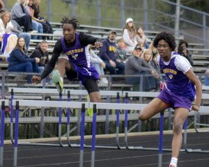Darrell Dean and Marcus Gill competing in the 110 meter hurdles 