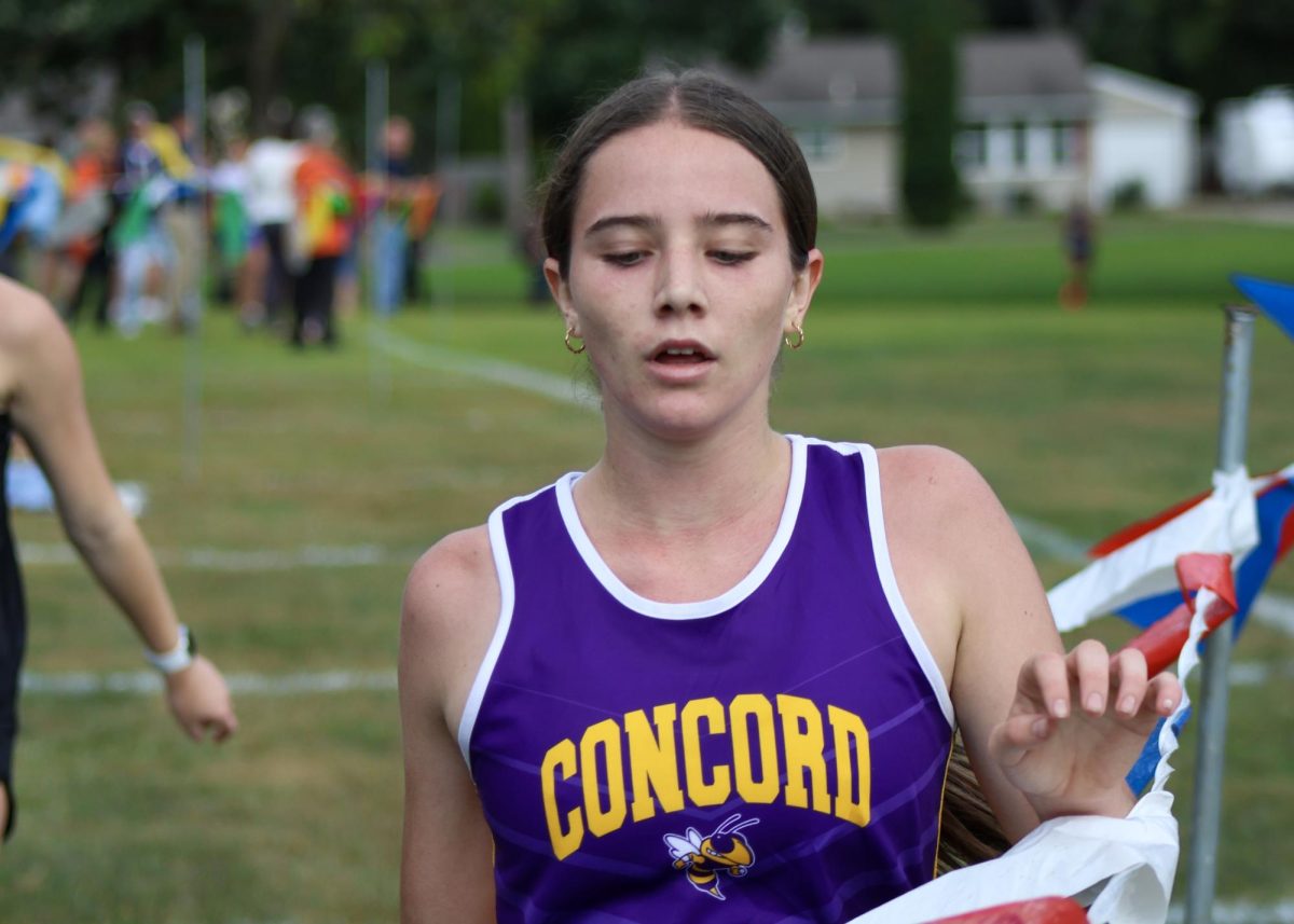 Haley Stimer crossing the finish line.