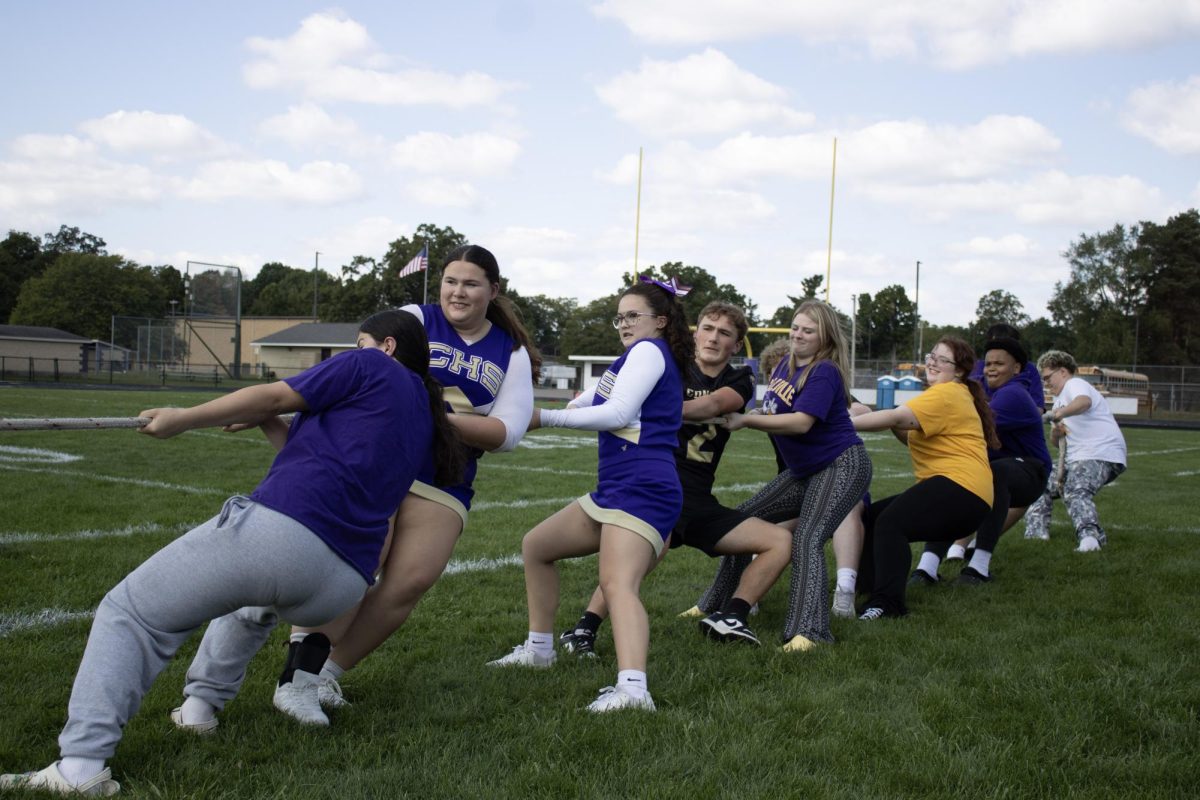 The sophomore class playing tug a war.