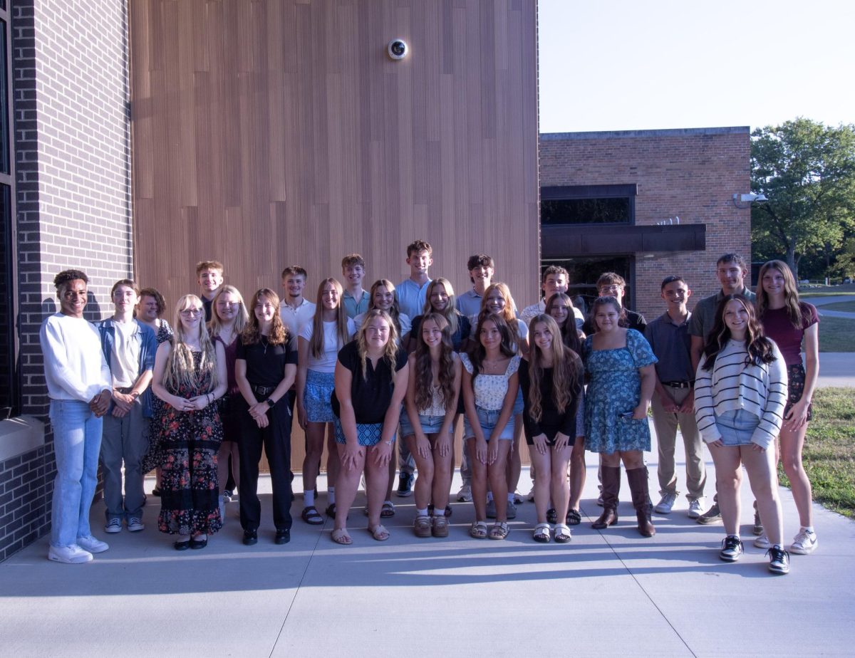 All members, new and old standing in front of the hive 