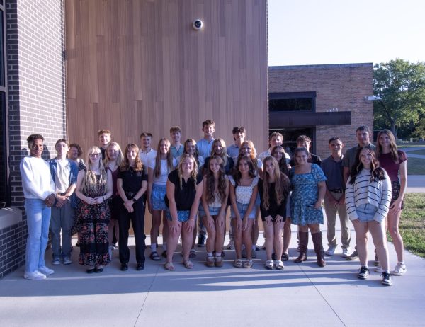 All members, new and old standing in front of the hive 