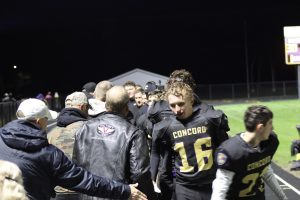 Football players thank Veterans.