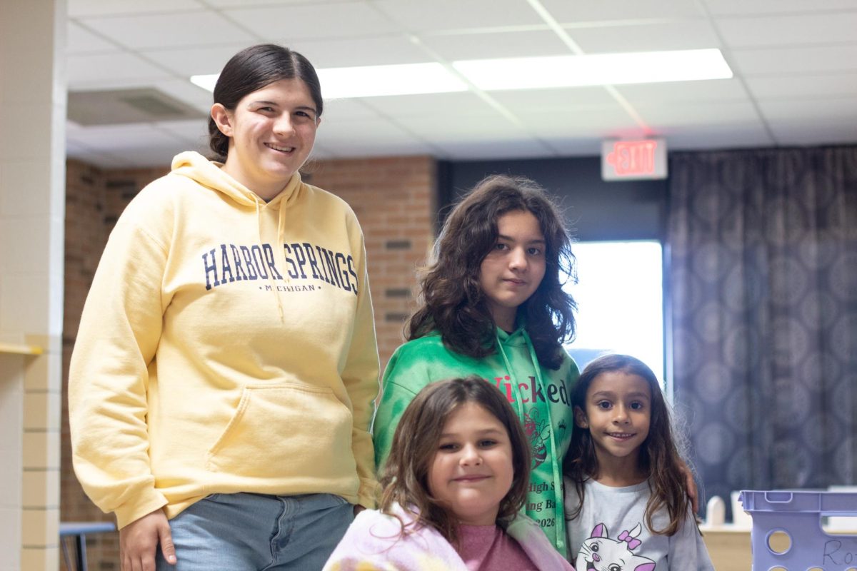 Rachel Randle and Jaqueline Calva work with elementary students as part of their hands-on experience.  