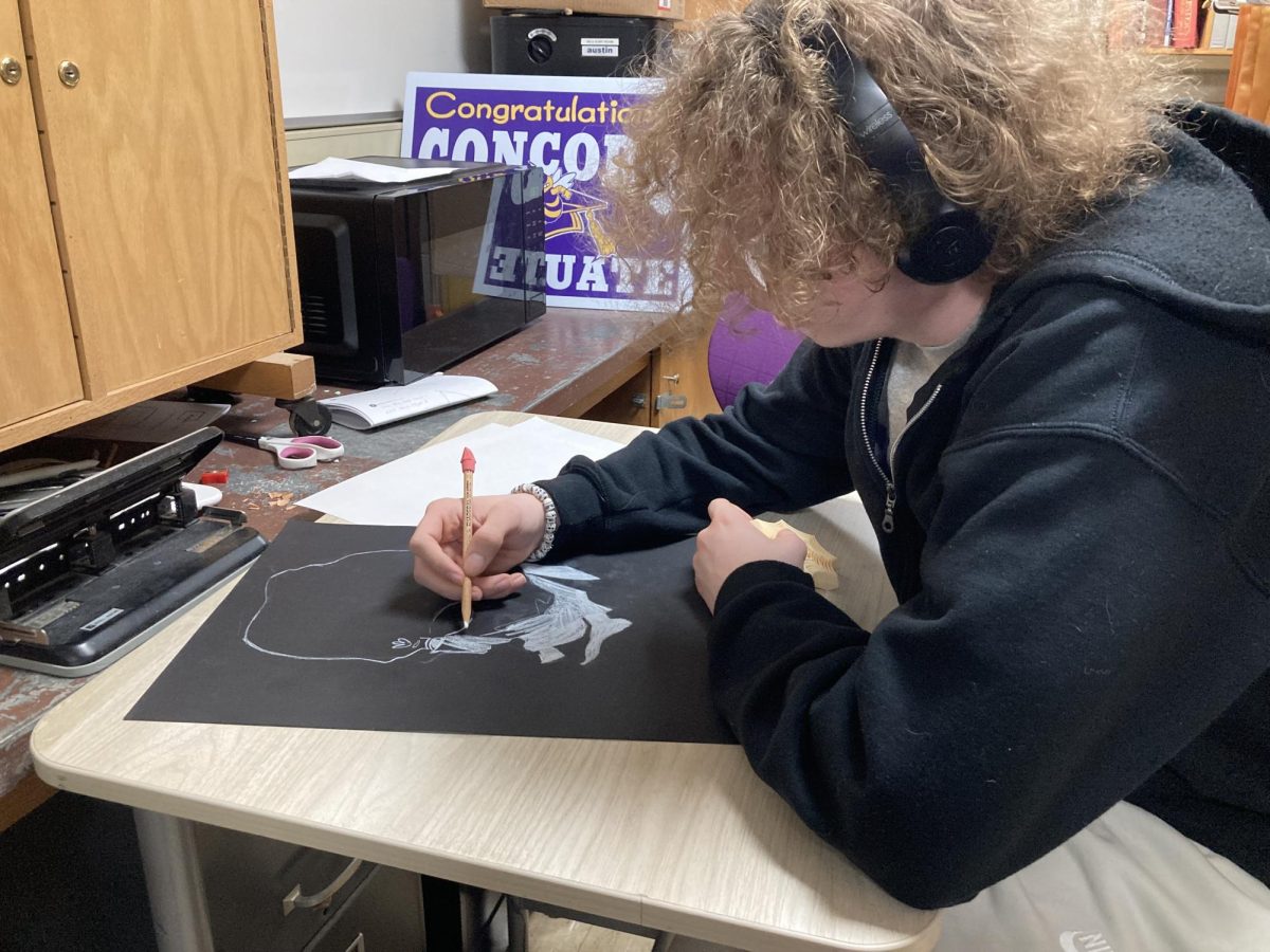 Eddie Smith working on his white charcoal project 