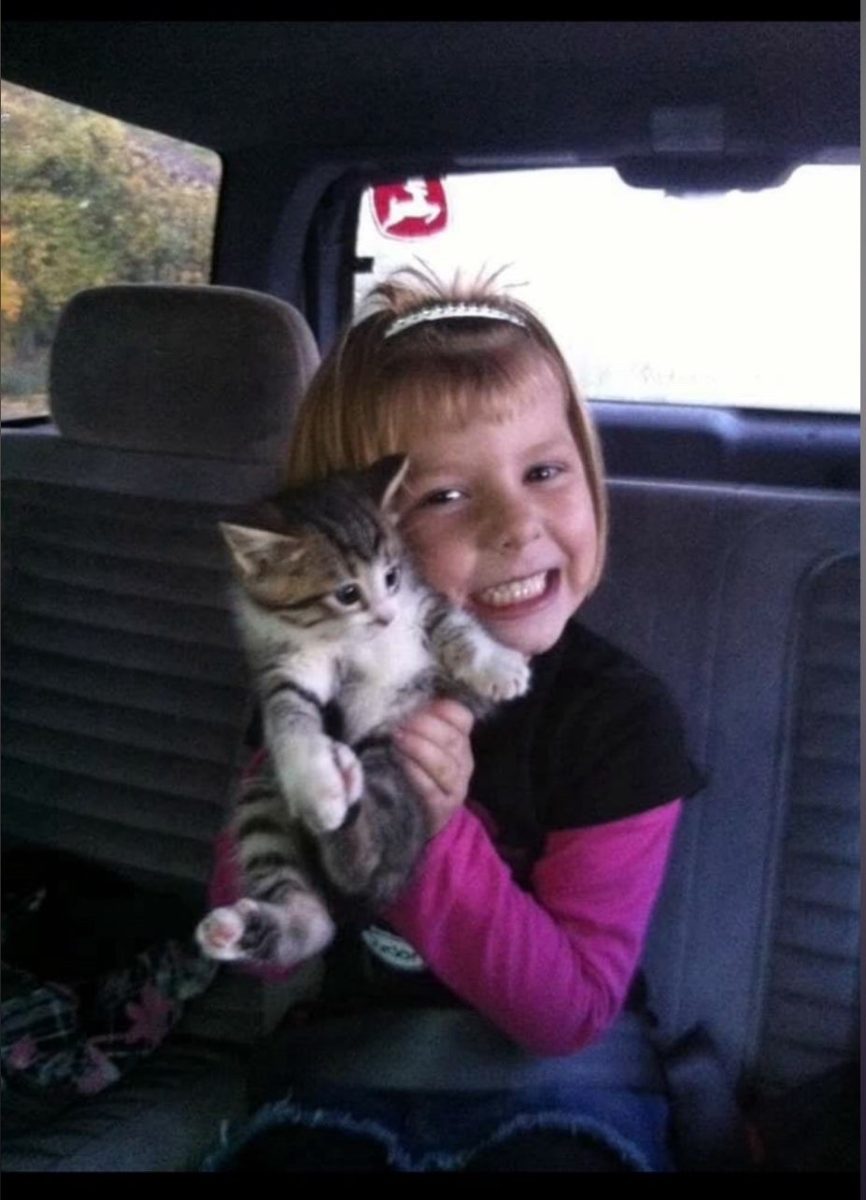 Younger Jordyan Metcalf posing with a kitten. (Photo provided)