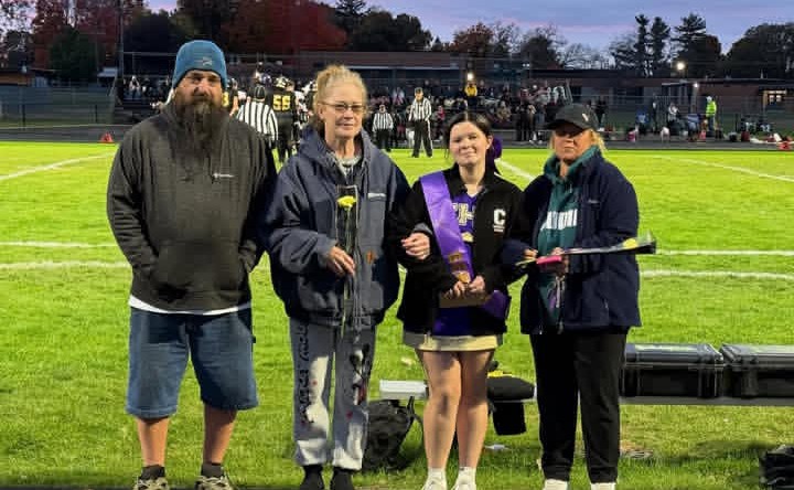 Jasmine Carr and her family at her last sideline cheer night.