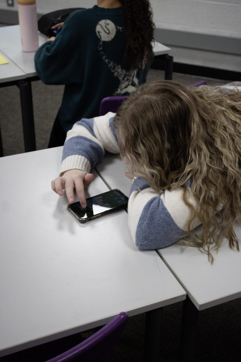 Student's phone stealing the spotlight in the classroom during instructional time.