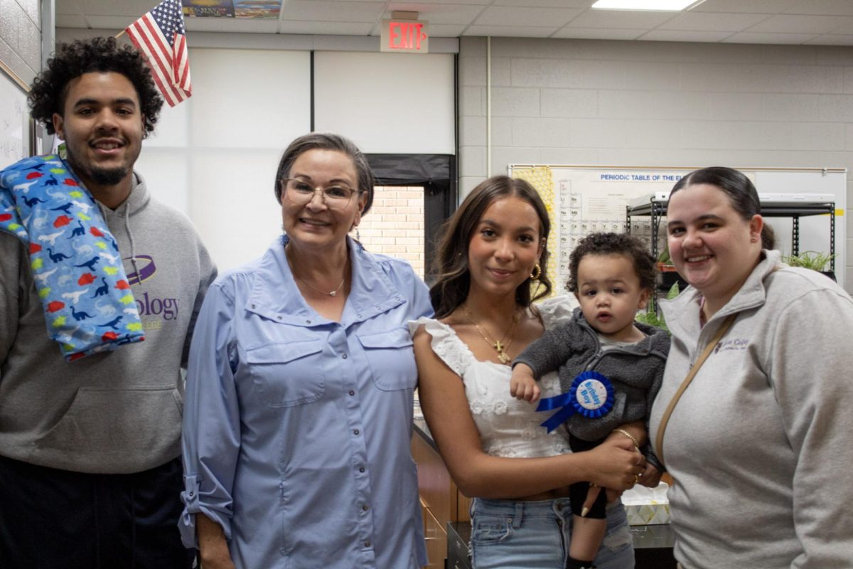 Mrs. Colangelo with alums Anthony Evans and Marielle Bommarito as well as graduating senior Mina Slone.  